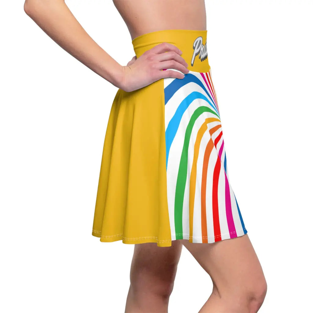 A person is wearing a colorful skirt with a spiral of rainbow stripes converging at the center, celebrating worldwide PRIDE. The yellow waistband features Pride in white script, representing the LGBTQ community, as their hand rests elegantly on the side.
