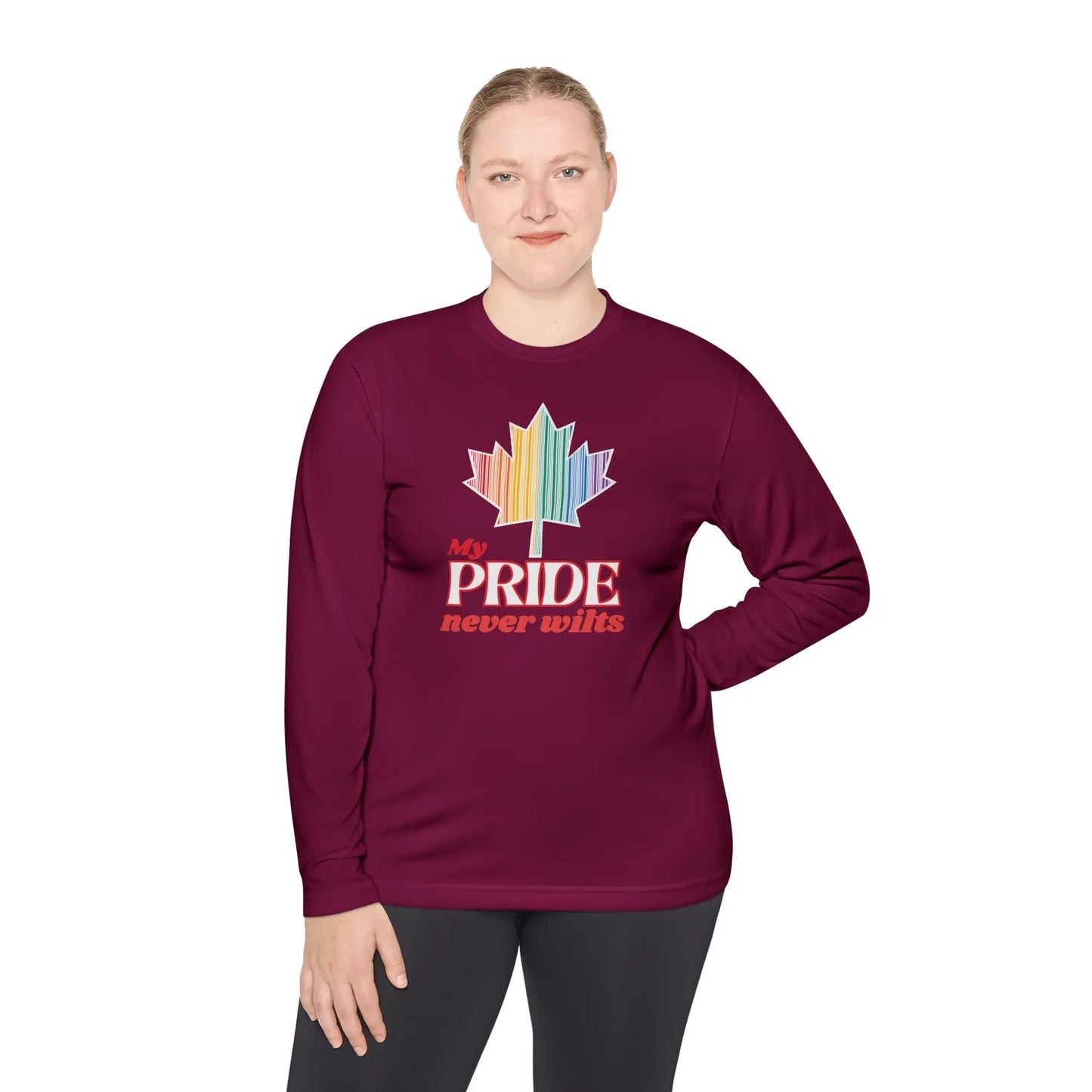 A person wearing a long sleeve maroon t-shirt with a colorful graphic that reads 'My PRIDE never wilts'.