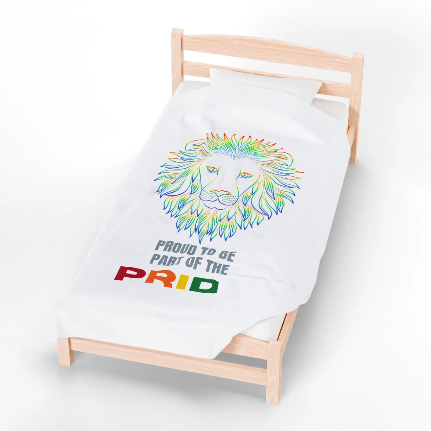 White blanket with rainbow lion design and 'Proud to be part of the Pride' text on a bed.