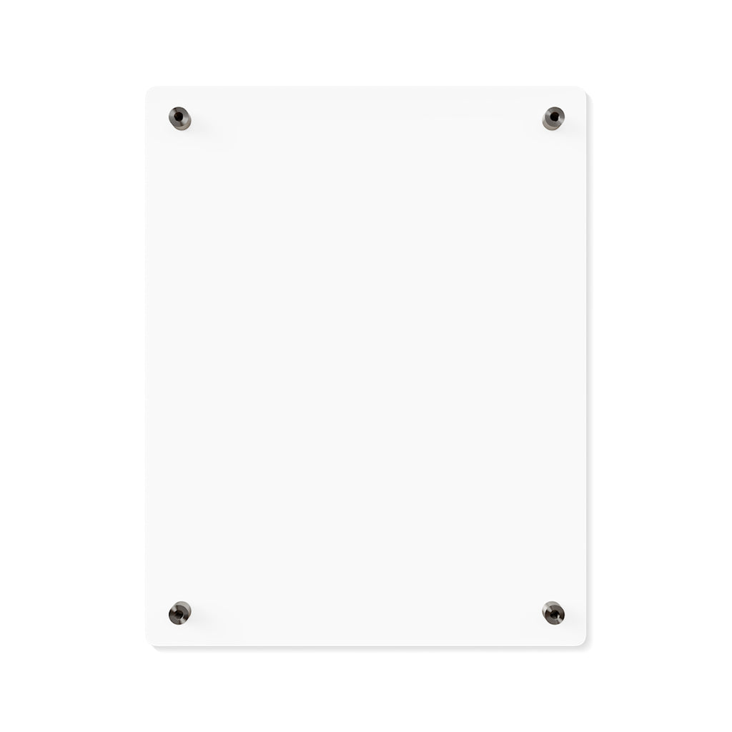 The back of the Speak Your Truth wall art. It is a blank, white rectangular board mounted on a wall with four black screws at the corners. The background is plain white, highlighting the simplicity and minimalism of the board.