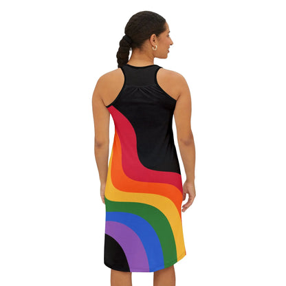 Back side view of a person wearing a sleeveless black racerback dress adorned with colorful rainbow stripes and the word Pride boldly across the chest. They stand confidently against a plain white background, celebrating Worldwide PRIDE.
