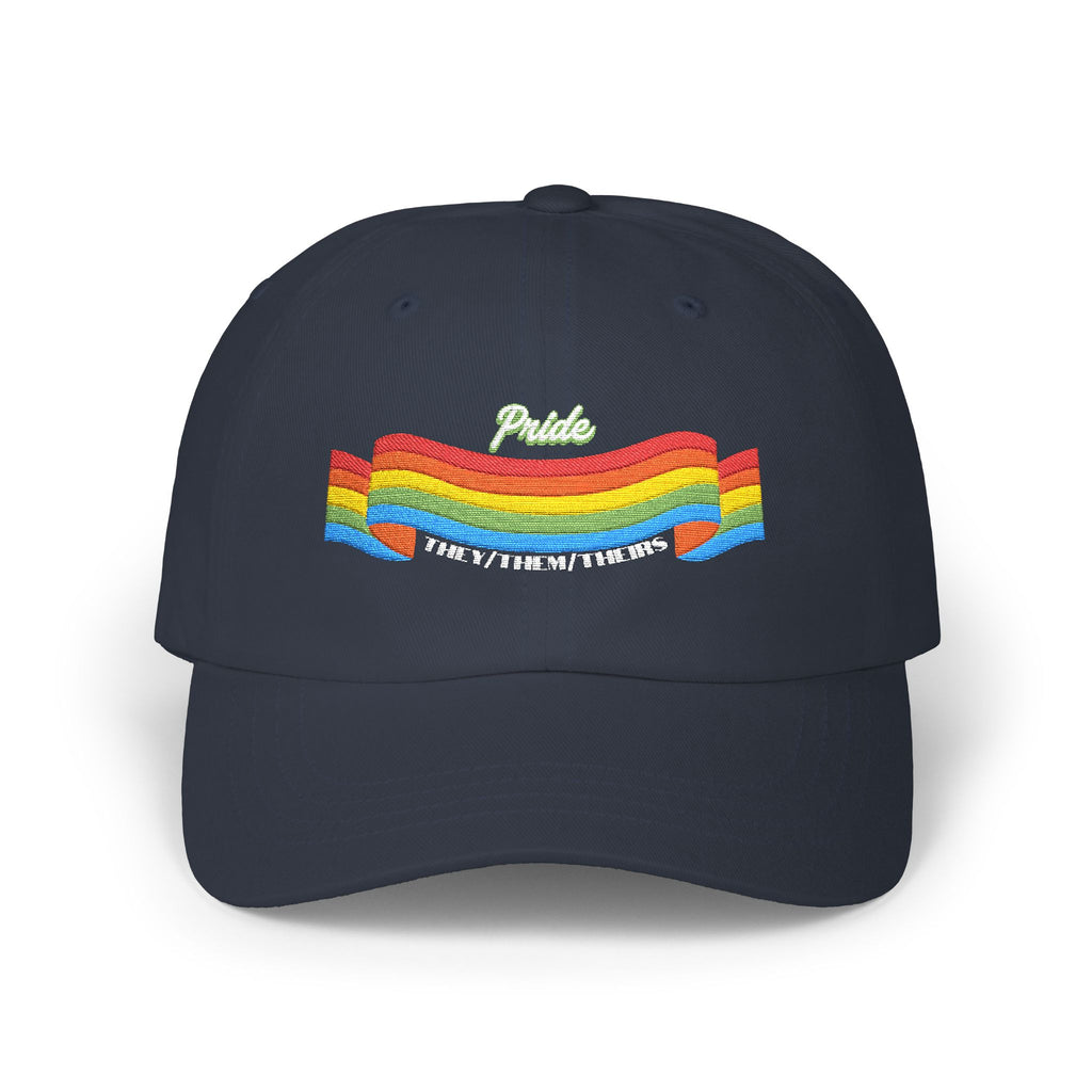 A navy blue cap from the Worldwide PRIDE store, featuring a rainbow design and the embroidered pronouns they/them/theirs.