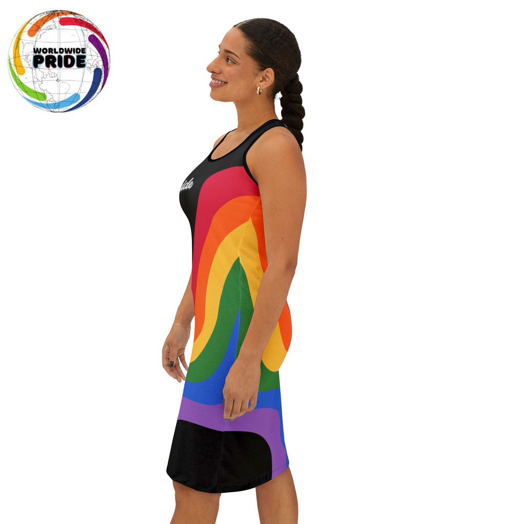 Left side view of a person smiling and wearing a sleeveless black racerback dress adorned with colorful rainbow stripes and the word Pride boldly across the chest. They stand confidently against a plain white background, celebrating Worldwide PRIDE.
