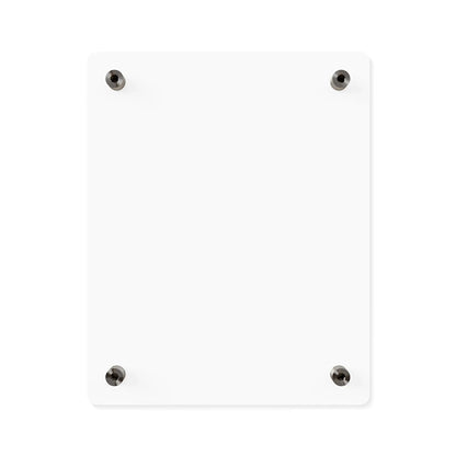 The back of the Speak Your Truth wall art. It is a blank, white rectangular board mounted on a wall with four black screws at the corners. The background is plain white, highlighting the simplicity and minimalism of the board.