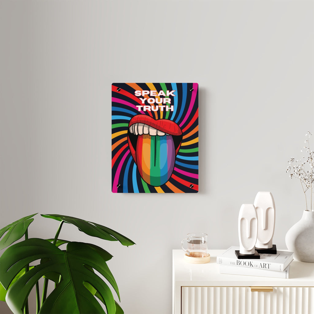 Worldwide PRIDE presents a vibrant piece of wall art that depicts an open mouth with rainbow-colored lips and tongue against a swirling rainbow backdrop. The words Speak Your Truth celebrate the LGBTQ community. Nearby, a plant and decorative items add charm to the scene.
