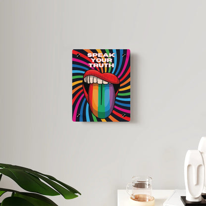 Worldwide PRIDE presents a vibrant piece of wall art that depicts an open mouth with rainbow-colored lips and tongue against a swirling rainbow backdrop. The words Speak Your Truth celebrate the LGBTQ community. Nearby, a plant and decorative items add charm to the scene.