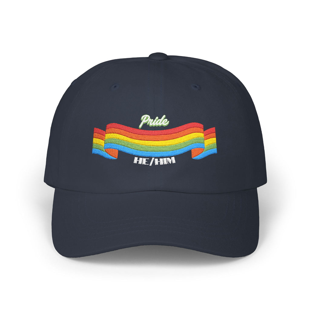 A navy blue cap from the Worldwide PRIDE store, featuring a rainbow design and the embroidered pronouns he/him.