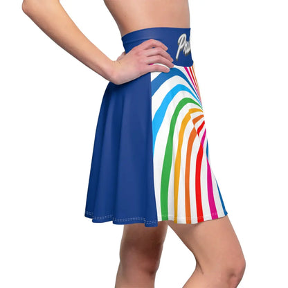 A person is wearing a colorful skirt with a spiral of rainbow stripes converging at the center, celebrating worldwide PRIDE. The blue waistband features Pride in white script, representing the LGBTQ community, as their hand rests elegantly on the side.
