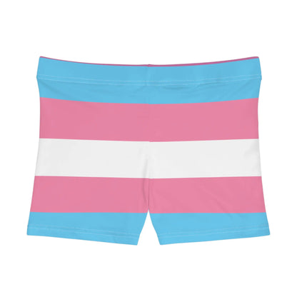 A photo of colorful shorts with pink, blue, and white horizontal stripes echoes the design of the transsexual flag.