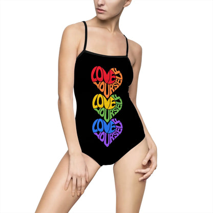 A person dons a black one-piece swimsuit featuring the vibrant message LOVE YOURSELF in heart shapes, symbolizing Worldwide PRIDE. The plain white background accentuates the colorful celebration of self-love and unity within the LGBTQ community.