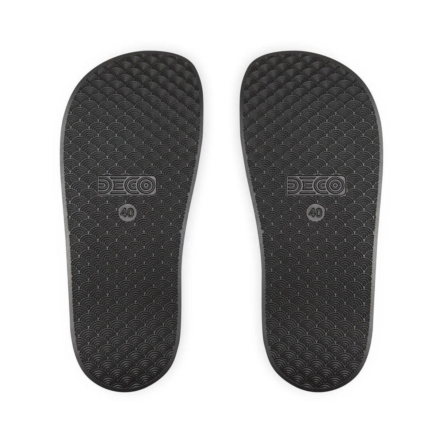 The soles of the black rainbow PRIDE slides.