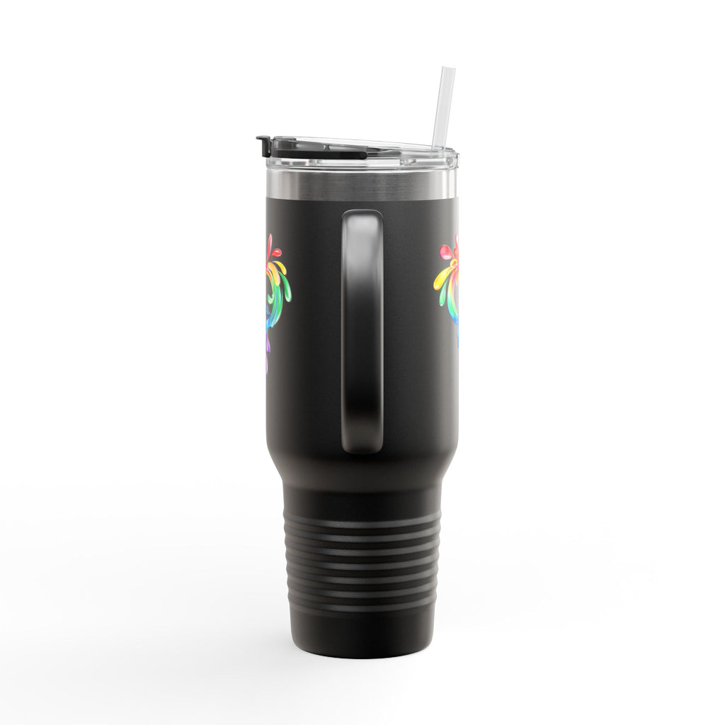 A white travel mug with a handle and a straw, showcasing a colorful heart made of water splashes. The Worldwide PRIDE cup is celebrating diversity and love.