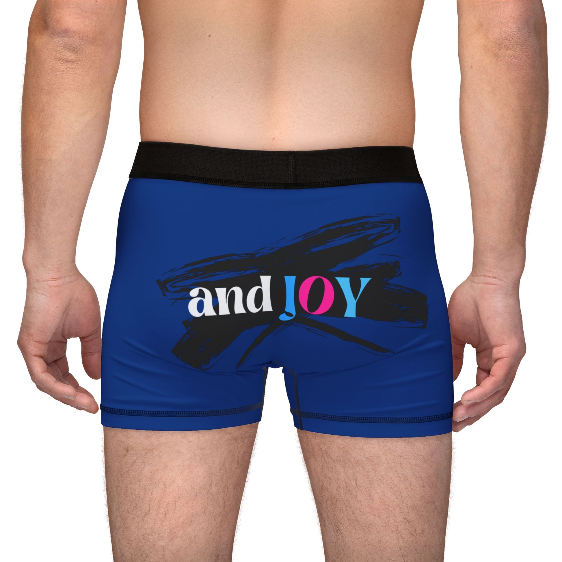 A person wearing blue boxer briefs with a black waistband, proudly showcasing My PRIDE in colorful letters on the front and and JOY on the back. This vibrant design celebrates the worldwide PRIDE and spirit of the LGBTQ community.