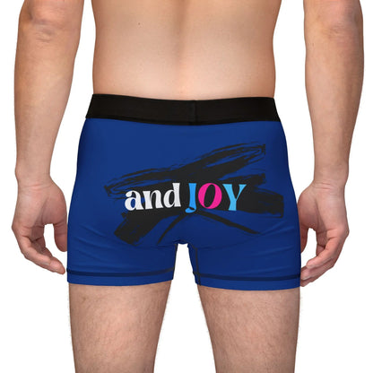 A person wearing blue boxer briefs with a black waistband, proudly showcasing My PRIDE in colorful letters on the front and and JOY on the back. This vibrant design celebrates the worldwide PRIDE and spirit of the LGBTQ community.