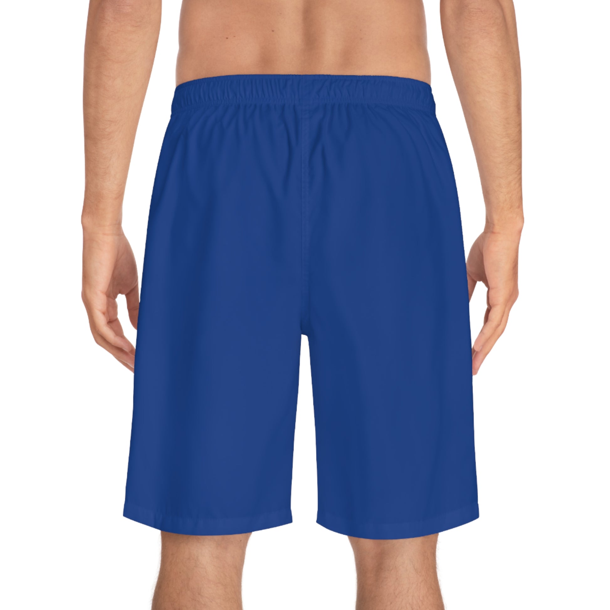 A person, seen from the back, is wearing blue board shorts.The shorts feature an elastic waistband.