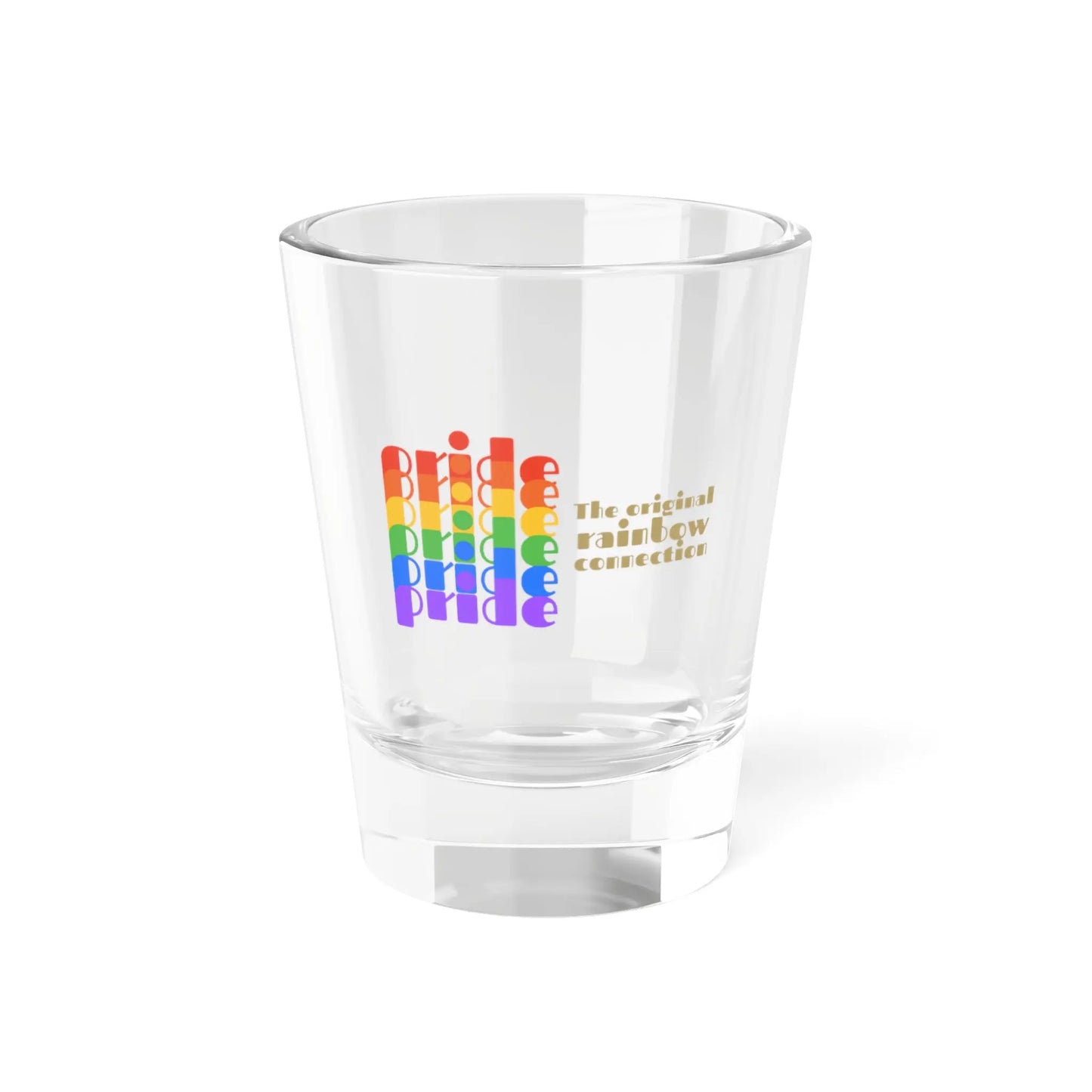 A clear shot glass features pride in a rainbow gradient on the left, celebrating the LGBTQ community. On the right, it reads The original rainbow connection in gold text. The glass, symbolizing worldwide PRIDE, sits empty against a white background.