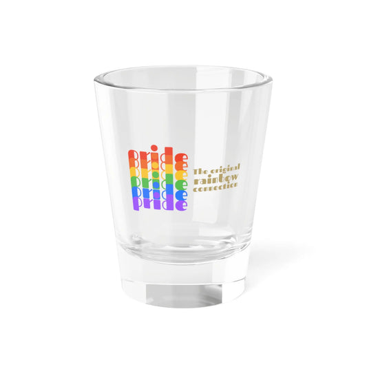 A clear shot glass features pride in a rainbow gradient on the left, celebrating the LGBTQ community. On the right, it reads The original rainbow connection in gold text. The glass, symbolizing worldwide PRIDE, sits empty against a white background.