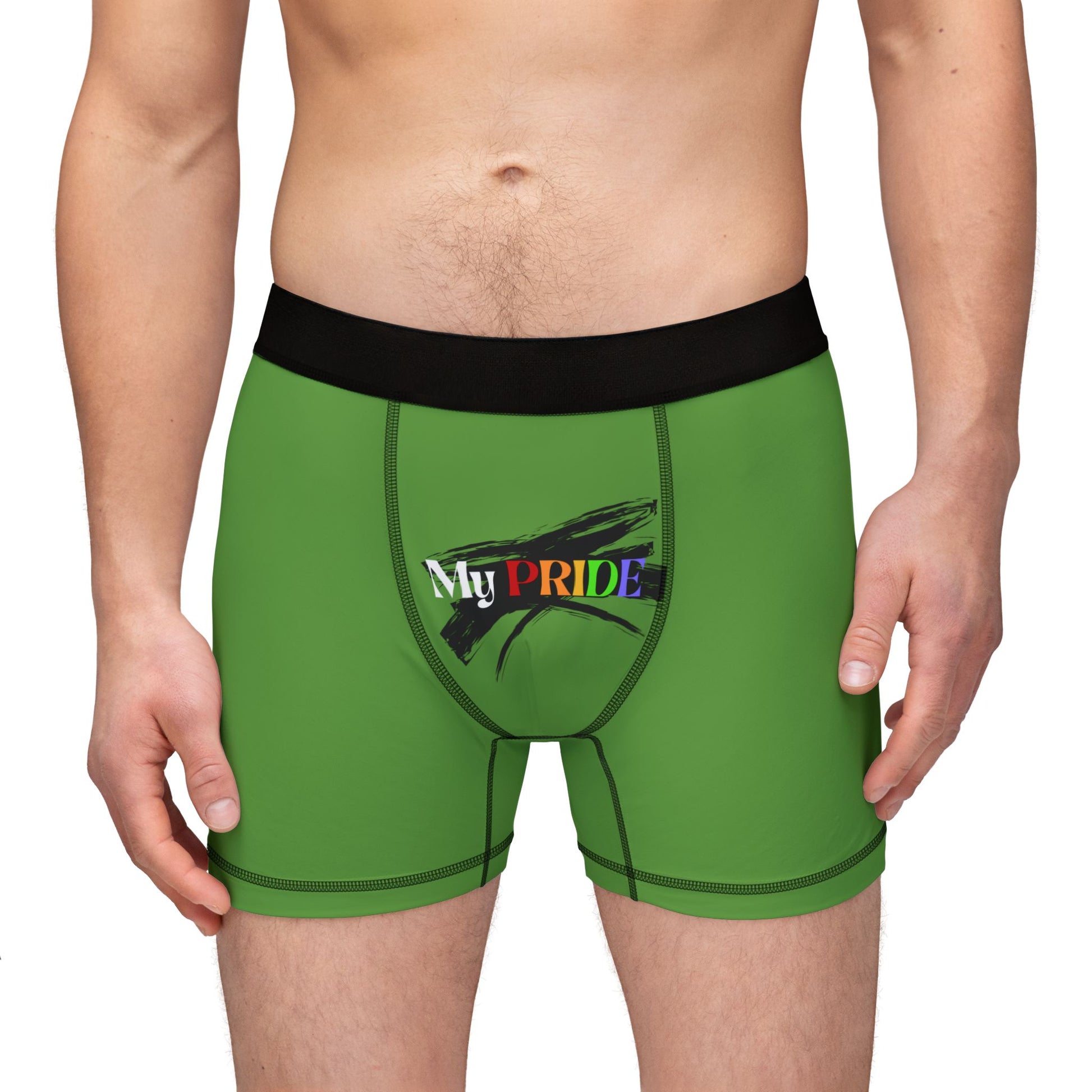 A person is wearing green boxer briefs featuring a black waistband. My PRIDE is boldly printed on the front, with PRIDE in vibrant rainbow colors, celebrating the worldwide PRIDE movement. The persons torso and upper thighs are visible, but their face remains unseen.