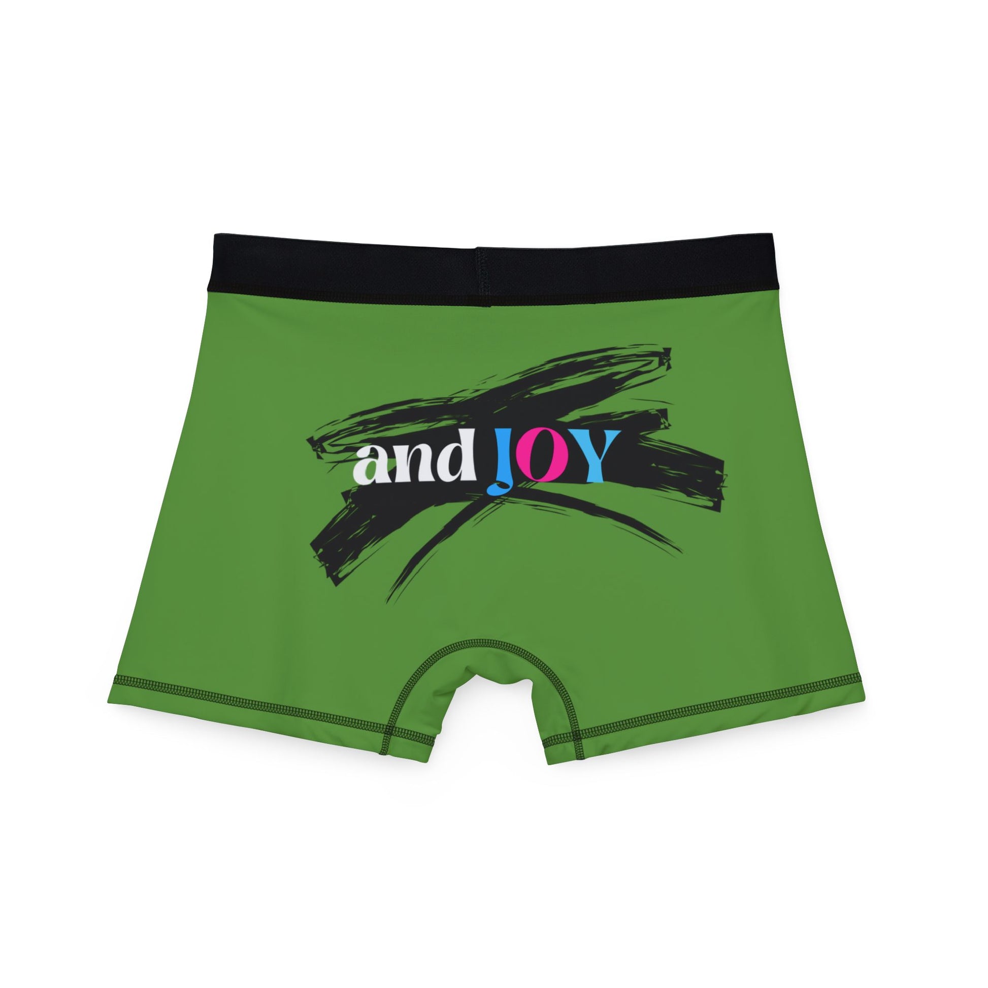 Rear view of green boxer shorts with a black waistband. The design boasts a black brushstroke and the words and JOY in white, pink, and blue on the back. Perfectly encapsulating Worldwide PRIDE,  against a plain background.