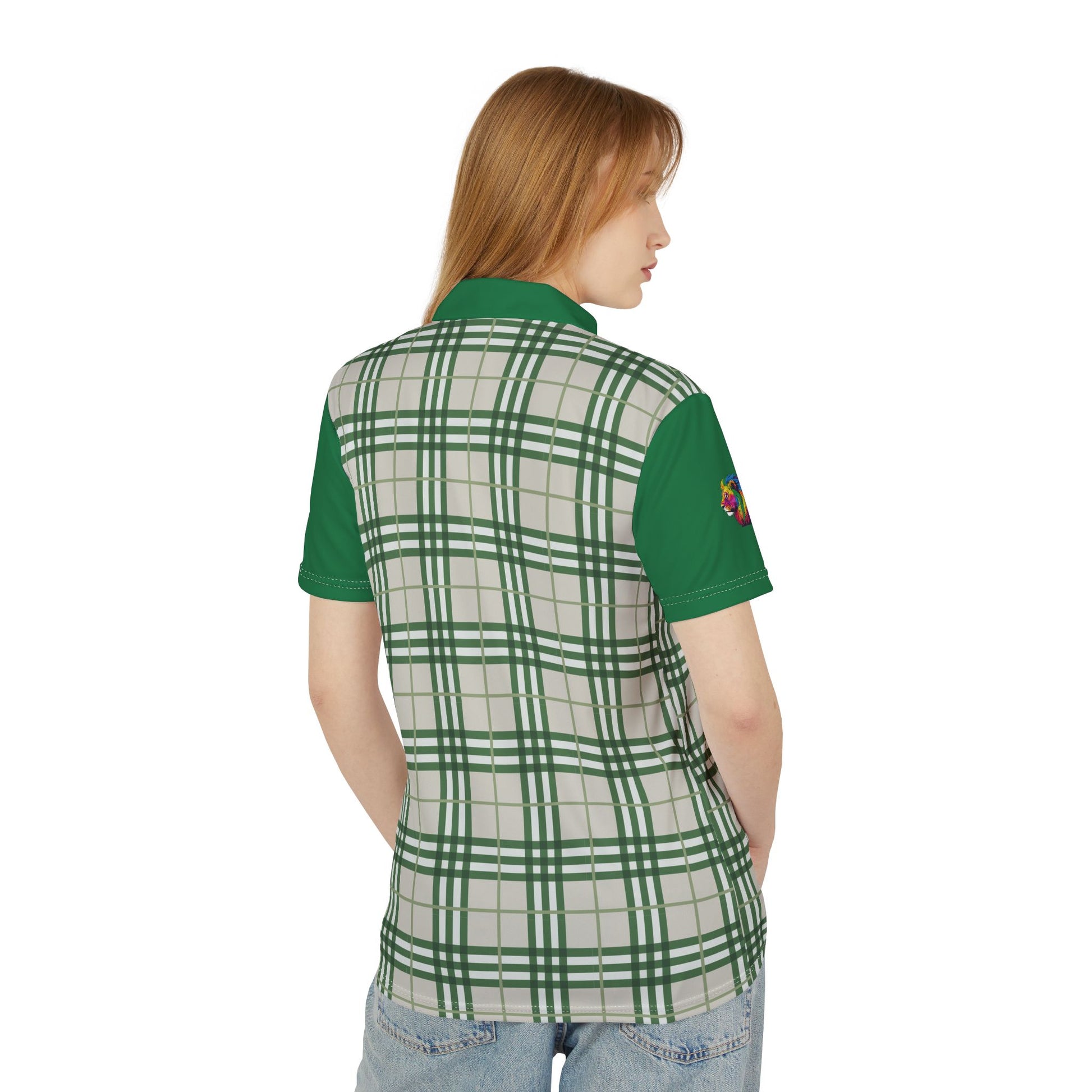 A person wearing a polo shirt showcasing a green "prideberry" plaid pattern on the front with solid green short sleeves. The shirt also features a collar and a small, colorful lion on the right sleeve, celebrating the LGBTQ community's vibrant spirit.