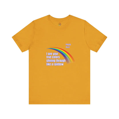 Mustard yellow t-shirt with rainbow and text design on a white background