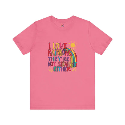 A pink unisex short-sleeve t-shirt with a colorful graphic that includes text saying "I love rainbows they're not straight either."