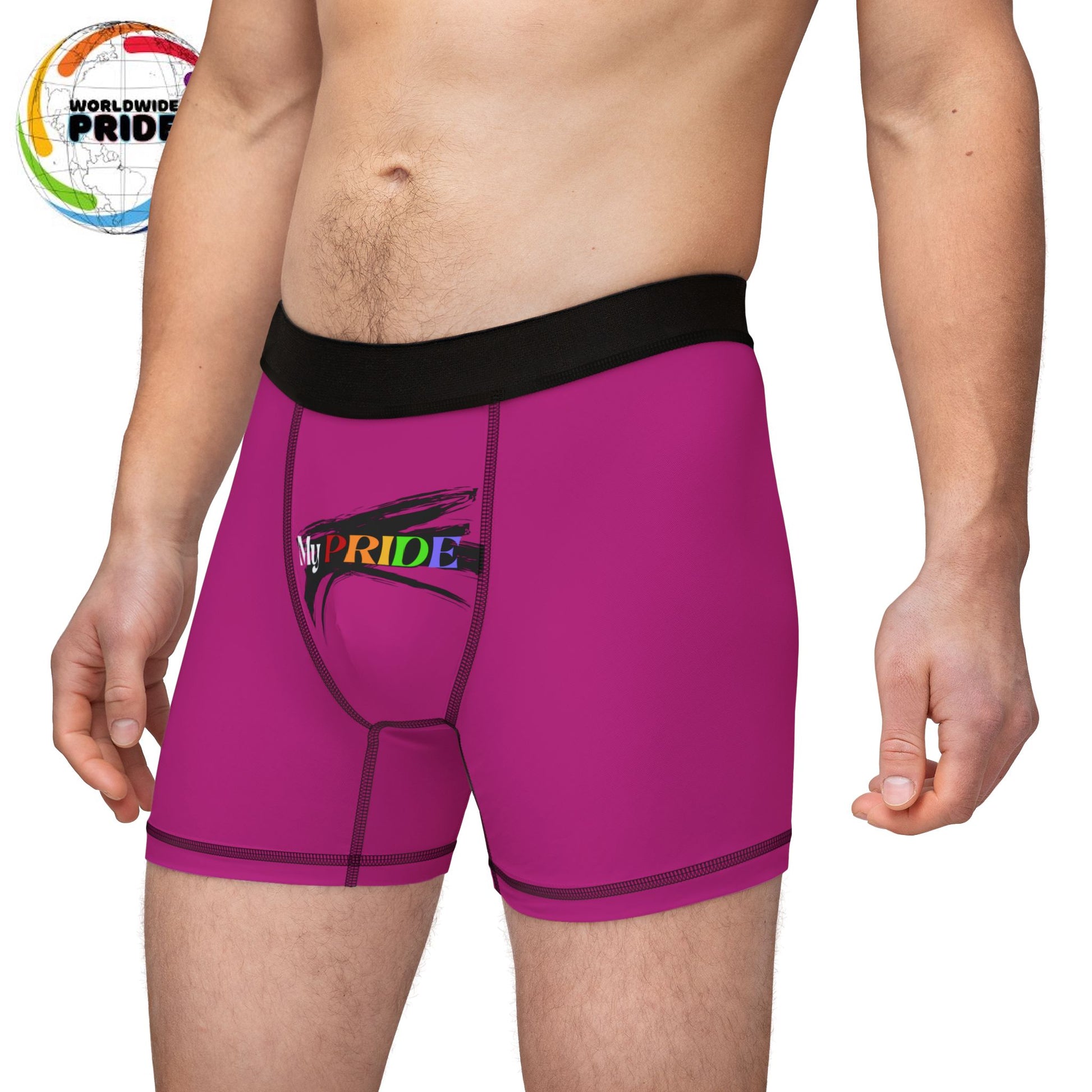 A person wearing pink boxer briefs with a black waistband, proudly showcasing My PRIDE in colorful letters on the front and and JOY on the back. This vibrant design celebrates the worldwide PRIDE and spirit of the LGBTQ community.