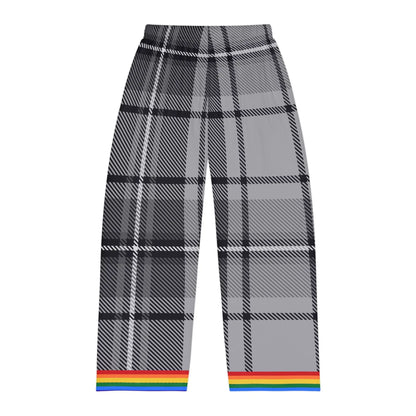A photo of the back of gray and black plaid pants with a rainbow trim at the cuffs.  The background is plain white.