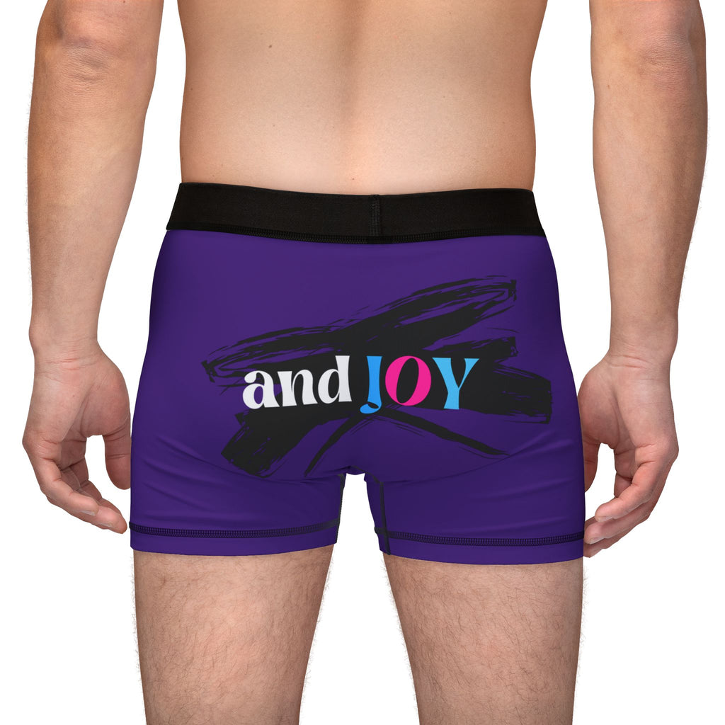 A person wearing purple boxer briefs with a black waistband, proudly showcasing My PRIDE in colorful letters on the front and and JOY on the back. This vibrant design celebrates the worldwide PRIDE and spirit of the LGBTQ community.