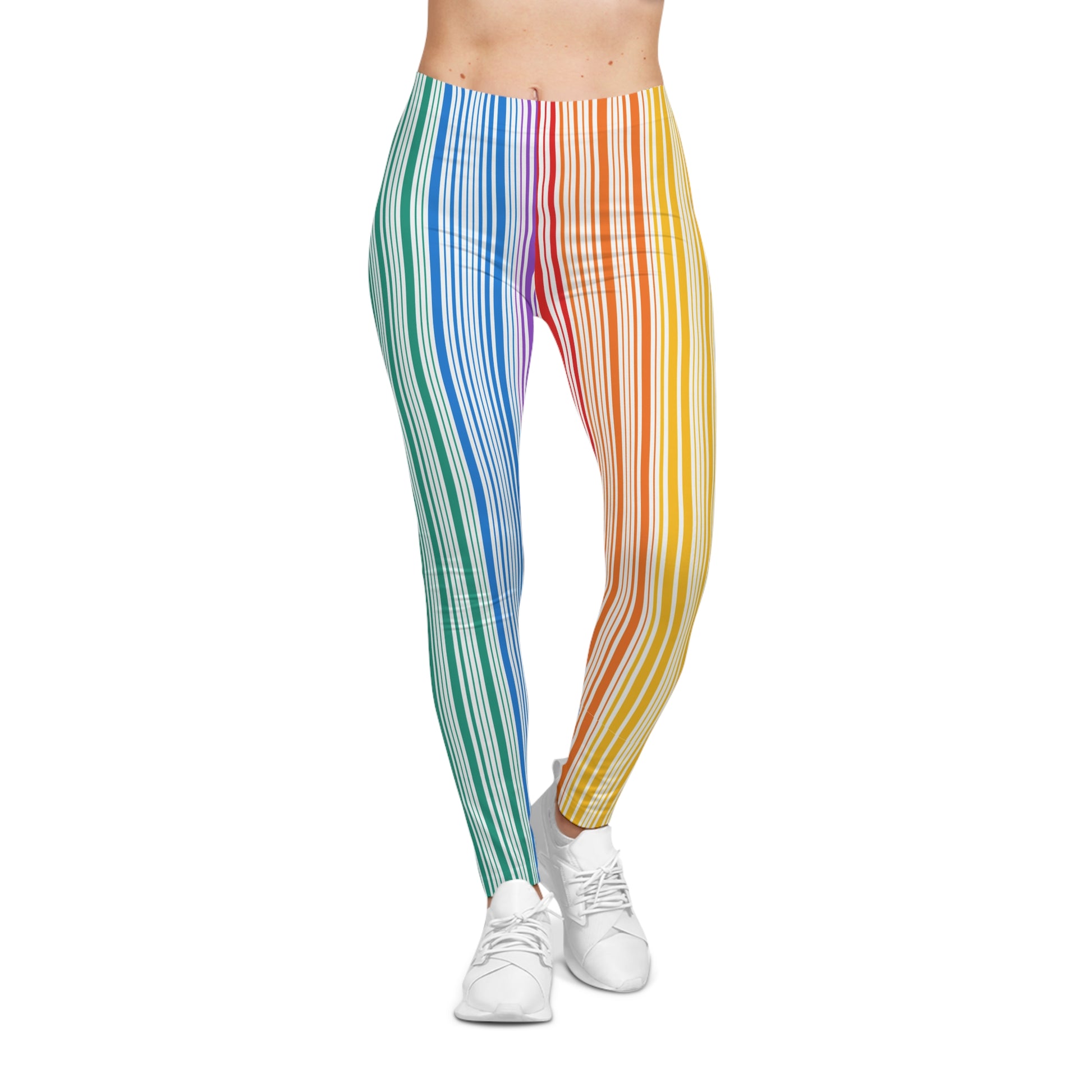 A person wearing colorful leggings with vertical stripes in a gradient from blue to red embodies the spirit of PRIDE. They are also wearing white sneakers and standing against a plain white background, celebrating vibrancy and diversity.