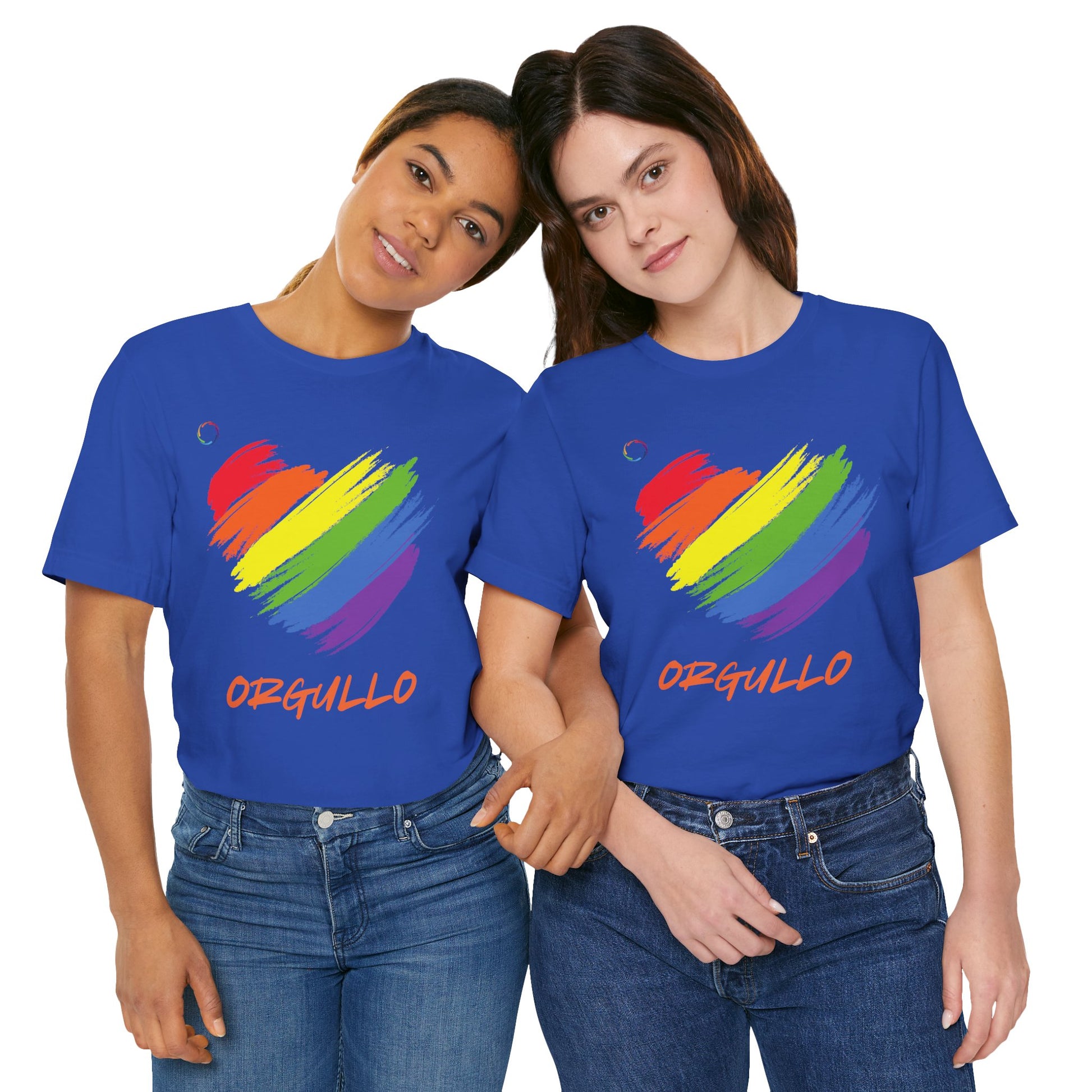 Two people standing arm in arm wear identical T-shirts featuring a rainbow-colored brushstroke heart design with the word ORGULLO, celebrating pride in Spanish, below in yellow-orange letters. Perfect for showing support for the LGBTQ community and Worldwide PRIDE events.