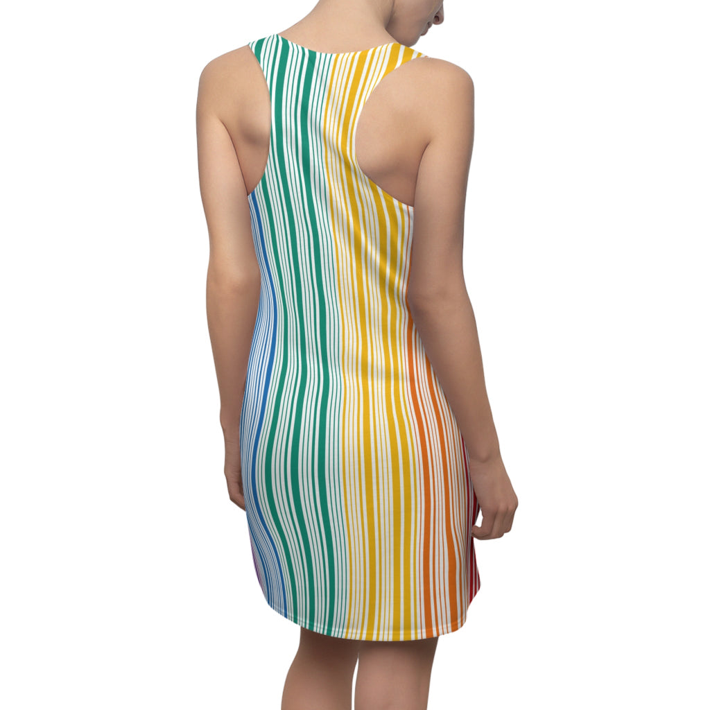 A person is wearing a sleeveless dress with vertical rainbow stripes, celebrating the vibrant spectrum from red to blue. With a plain white backdrop, this outfit is a bold nod to Worldwide PRIDE and the unity of the LGBTQ community.