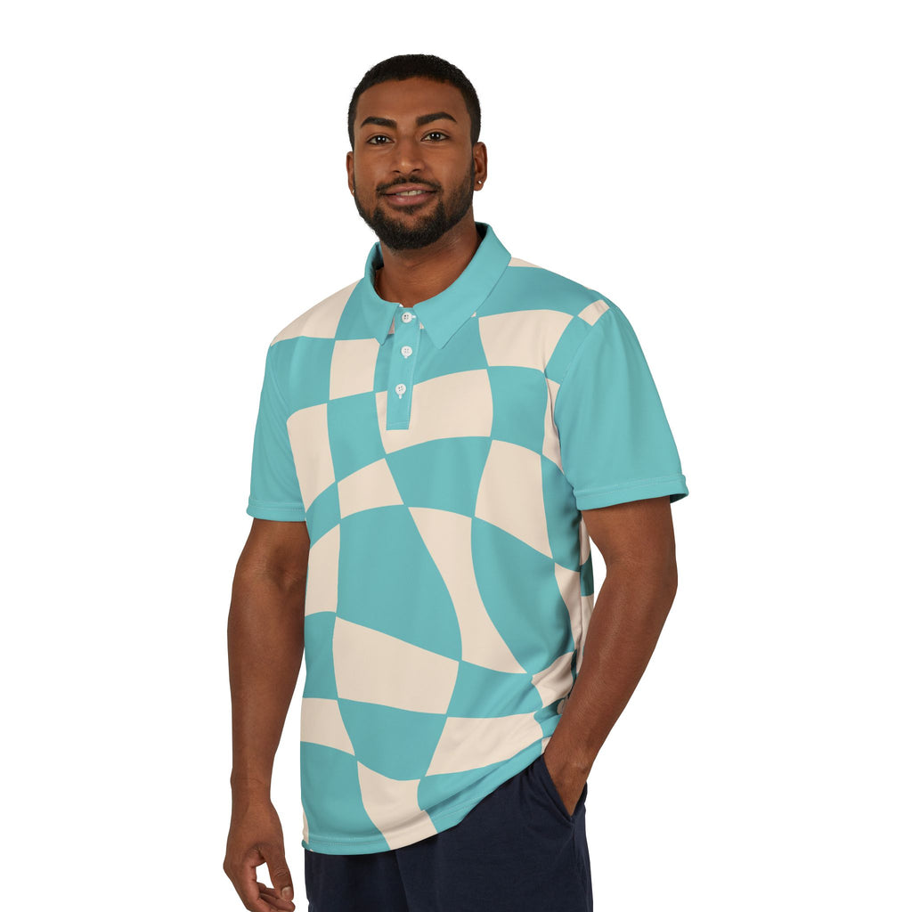 A person wears a polo shirt, part of the Subtlety collection, showcases a teal and cream checkered pattern. It features a colorful lion on the right sleeve and a button-up collar, embodying Worldwide PRIDE with its vibrant design.