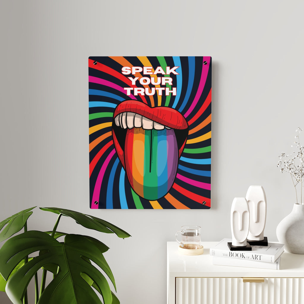 Worldwide PRIDE presents a vibrant piece of wall art that depicts an open mouth with rainbow-colored lips and tongue against a swirling rainbow backdrop. The words Speak Your Truth celebrate the LGBTQ community. Nearby, a plant and decorative items add charm to the scene.