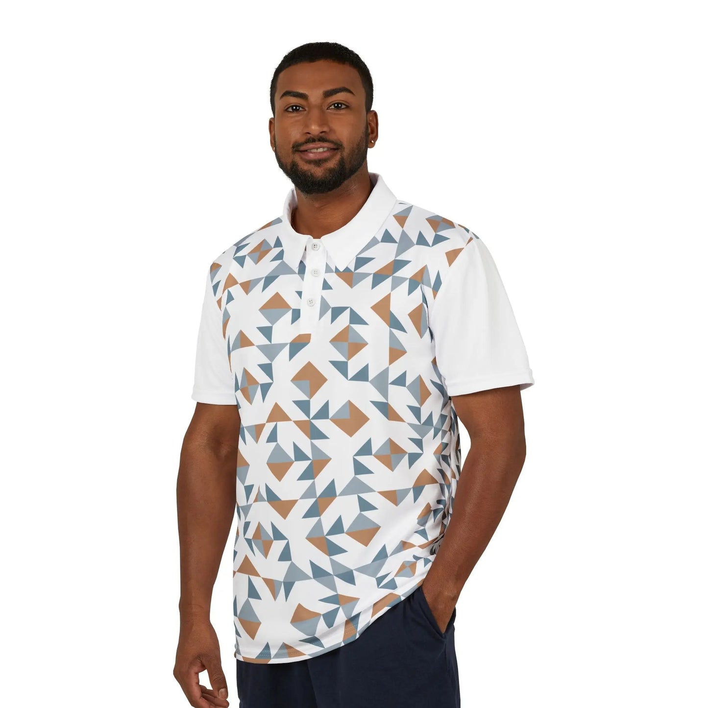 A person wears a white polo shirt boasts a geometric pattern with blue, brown, and white shapes. It features a collar, buttons, and a colorful lion on the left sleeve that embodies the spirit of Worldwide PRIDE. It is part of WWP's Subtlety collection.