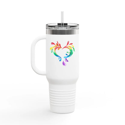 A white travel mug with a handle and straw, showcasing a colorful heart made of water splashes. The Worldwide PRIDE cup is celebrating diversity and love.