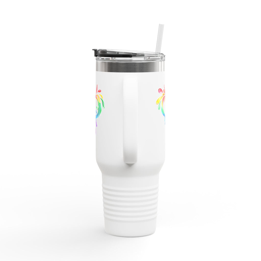 A white travel mug with a handle and straw, showcasing a colorful heart made of water splashes. The Worldwide PRIDE cup is celebrating diversity and love.