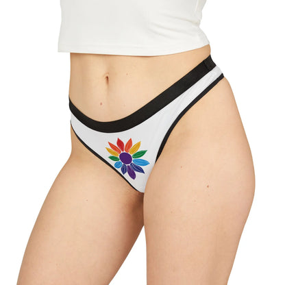 Woman wearing white underwear with a colorful flower design on a white background.