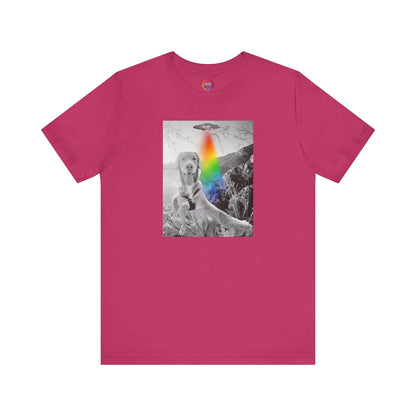 Pink t-shirt with a graphic of a UFO, a dog and a rainbow on a white background