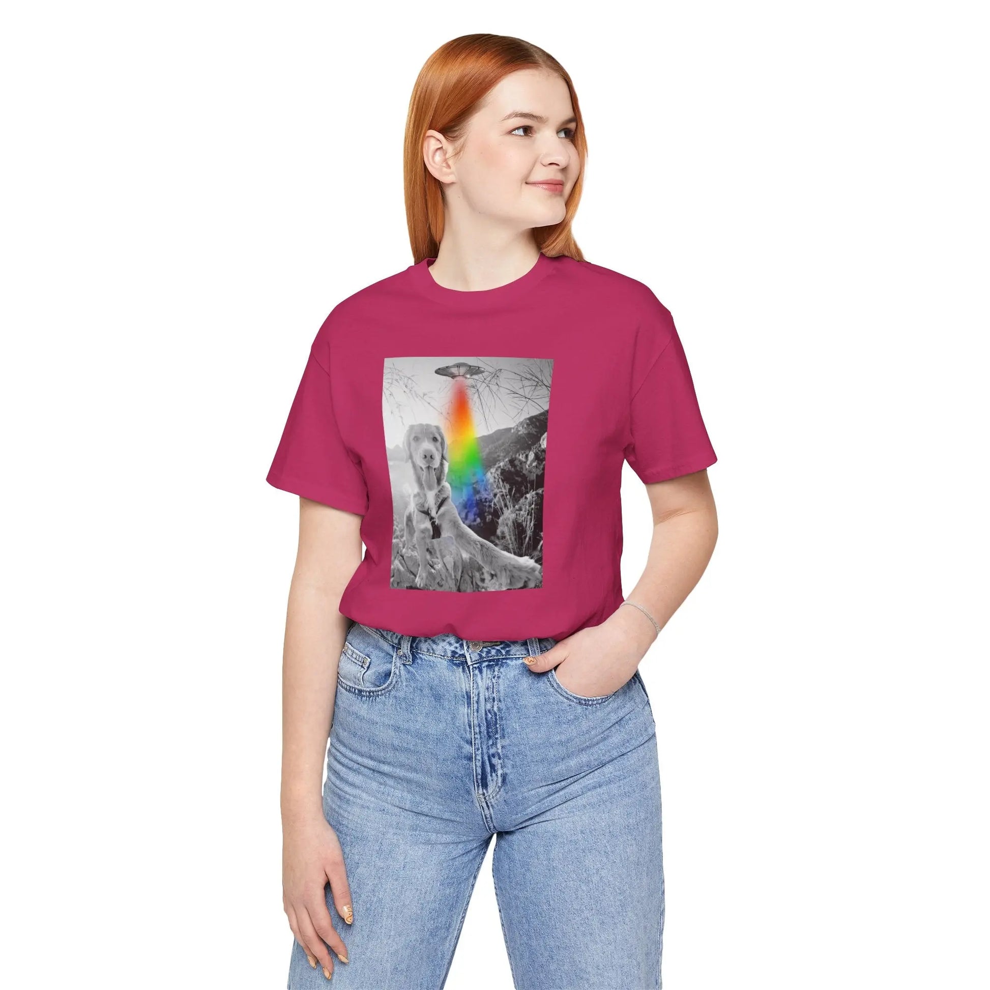 Person wearing a berry t-shirt with a graphic design of a dog and a UFO on a white background