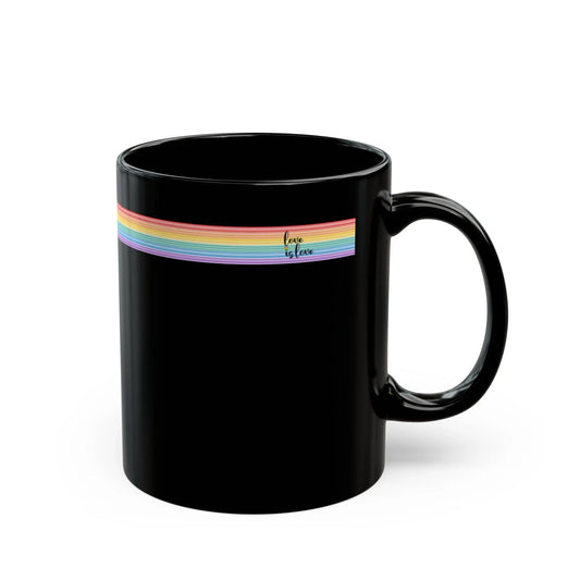Black mug with rainbow band and 'love is love' text on a white background