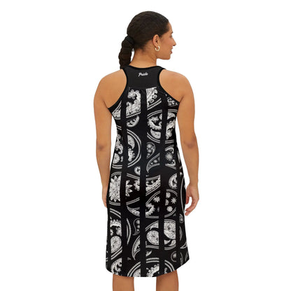 Woman wearing a black dress with white pattern from the back