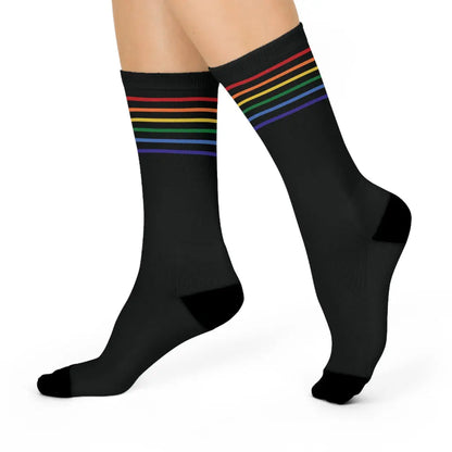 A pair of black crew socks with a colorful striped pattern representing the LGBTQ community.