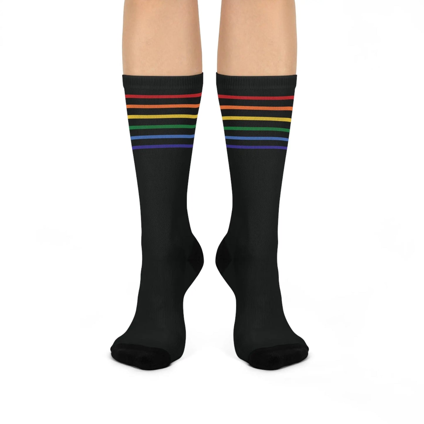 A pair of black crew socks with a colorful striped pattern representing the LGBTQ community.