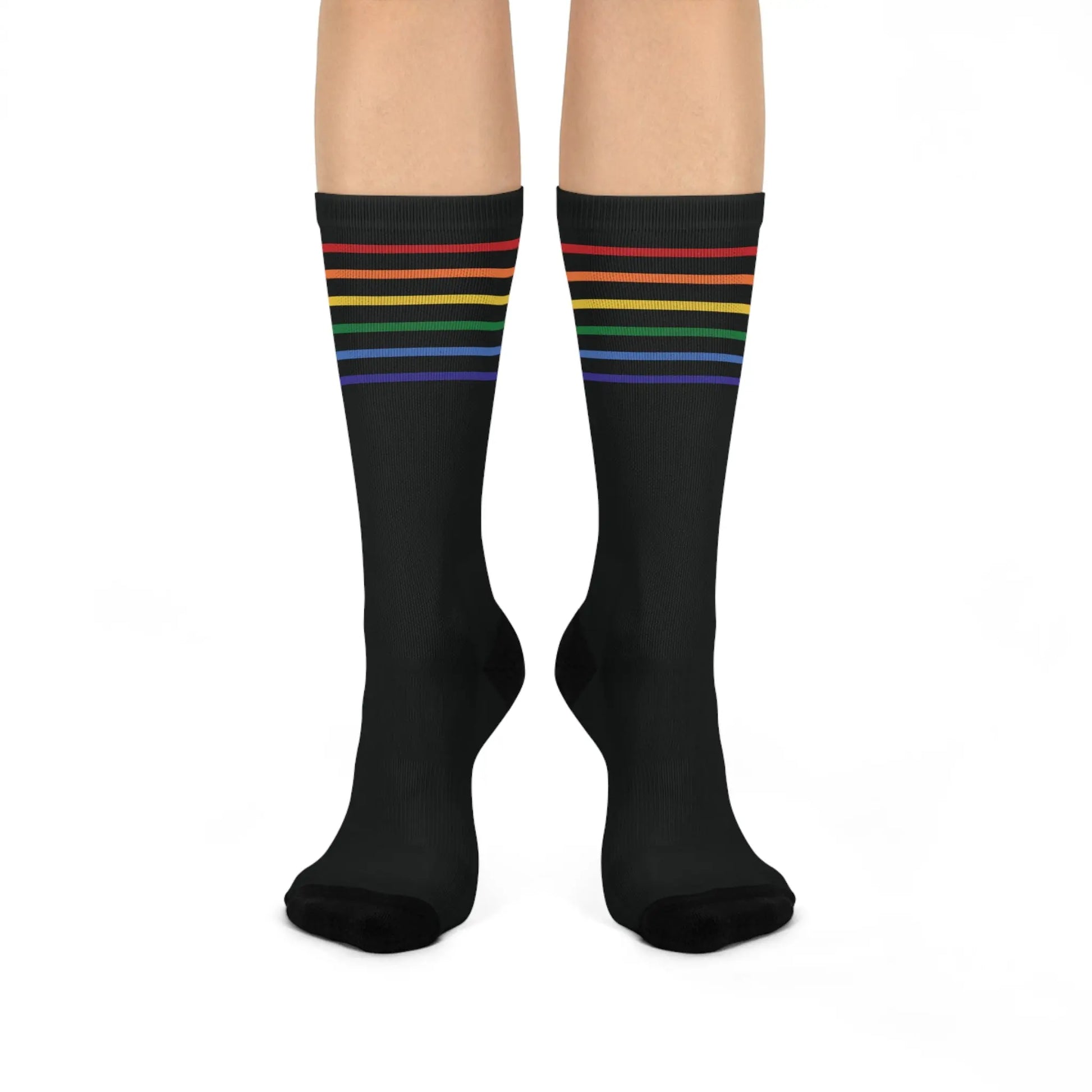 A pair of black crew socks with a colorful striped pattern representing the LGBTQ community.