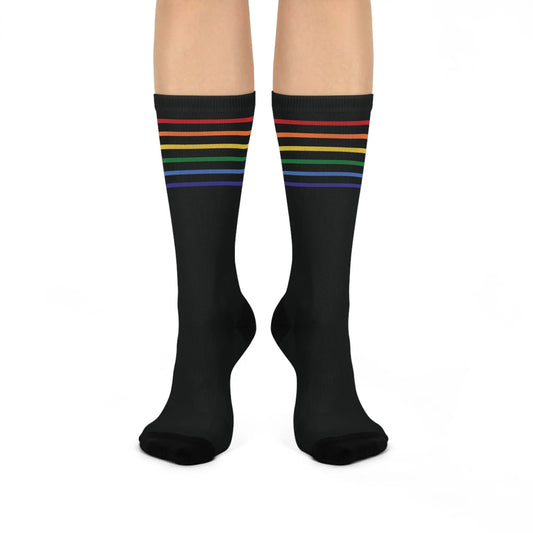 A pair of black crew socks with a colorful striped pattern representing the LGBTQ community.