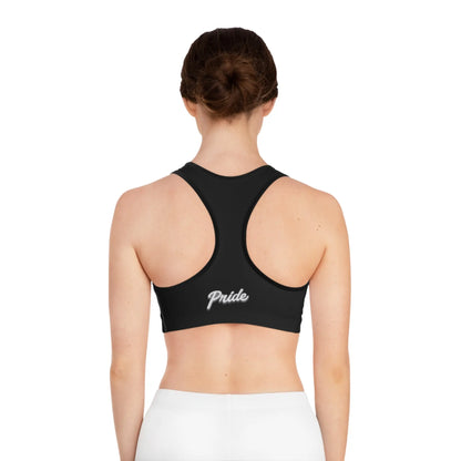 Back view of a erson wearing a black sports bra with 'pride' text.