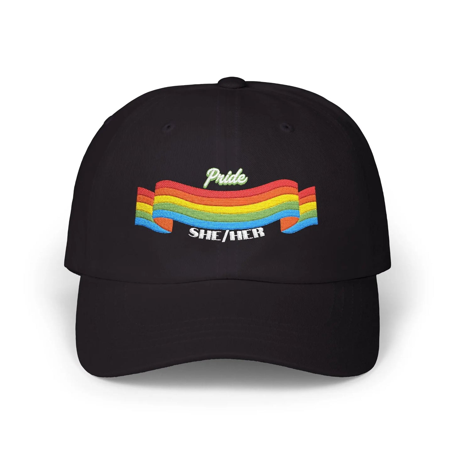 A black cap from the Worldwide PRIDE store, featuring a rainbow design and the embroidered pronouns she/her.