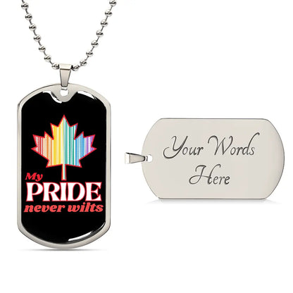 A stainless steel dog tag necklace with a colorful maple leaf and the text 'My PRIDE never wilts' on a black background.