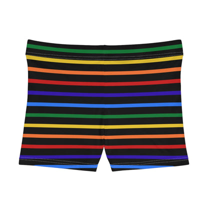 A pair of women's shorts featuring a striped pattern a glittery heart, and vibrant rainbow colors on a black background.